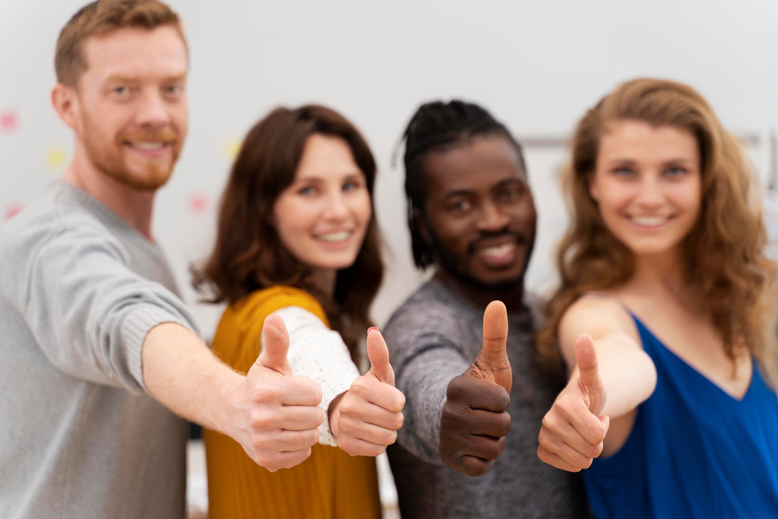 Cleaning staff in protective gear sanitizing an office space